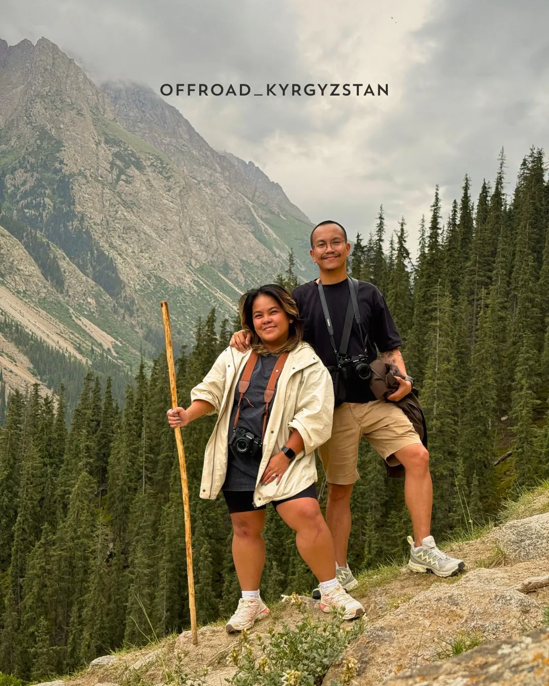 Filipino tourists exploring the mountains of Barskoon Gorge, Kyrgyzstan, during a guided jeep tour