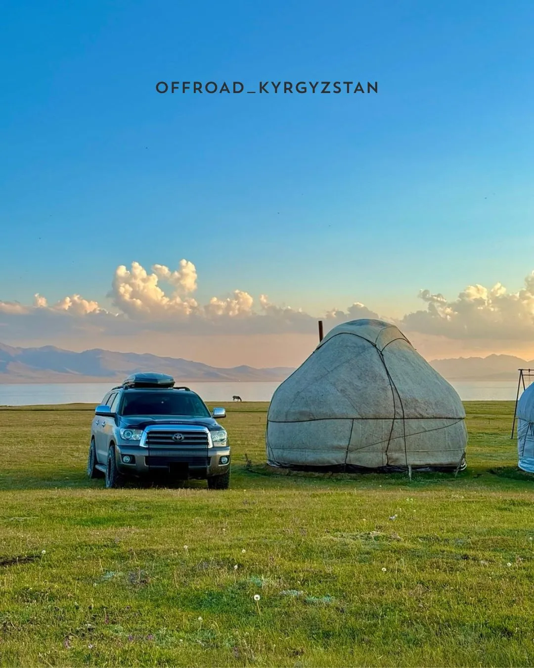 Toyota Sequoia off-road SUV parked near a traditional yurt at the shore of Son-Kul lake during an off-road expedition in Kyrgyzstan