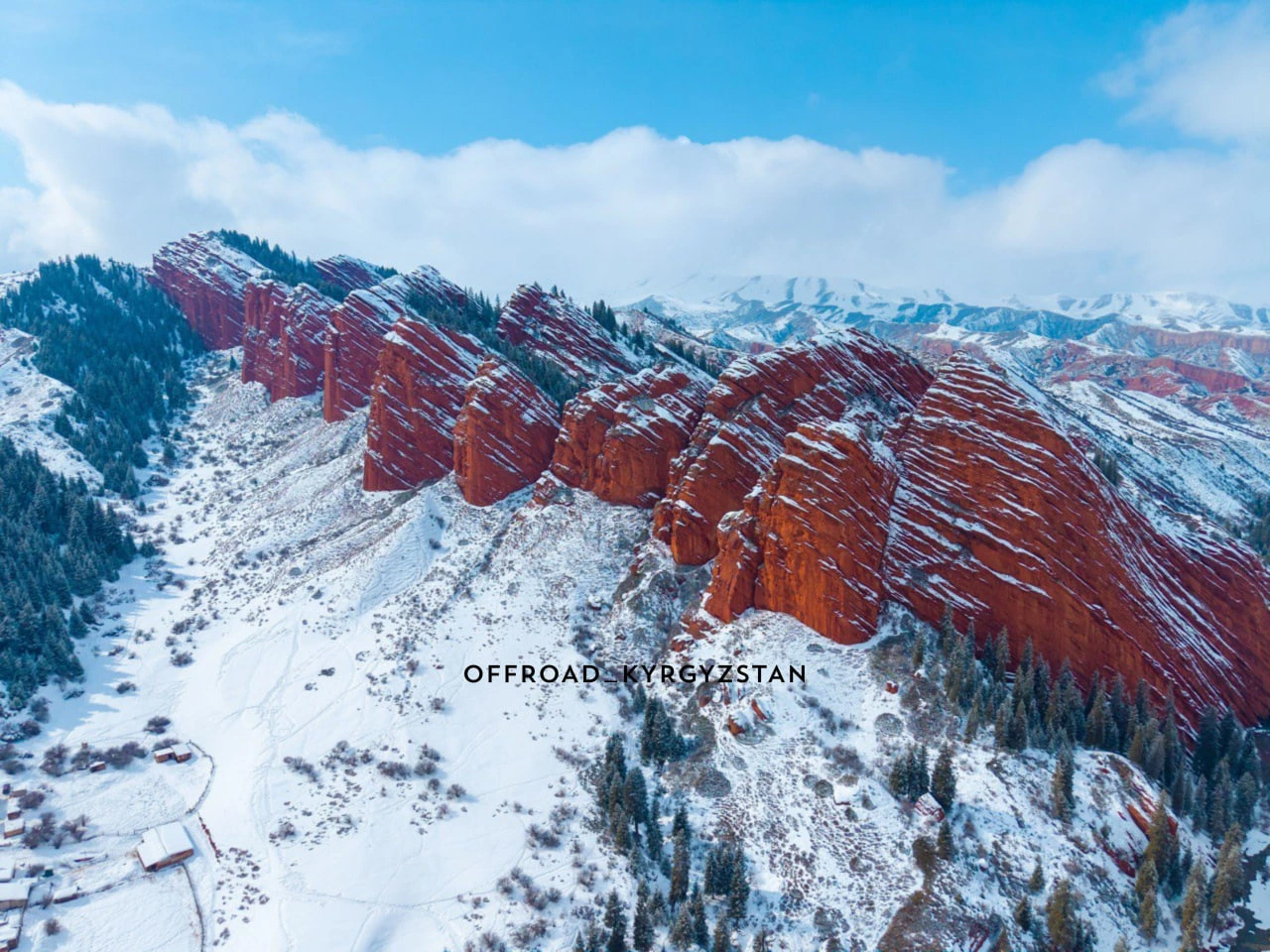 Snowy Jeti-Oguz rocks from above, a spectacular stop during our winter offroad tours in Kyrgyzstan.